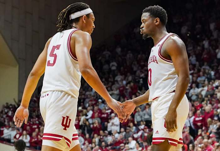 Indiana Hoosiers forward Malik Reneau (5) high-fives Indiana Hoosiers guard Xavier Johnson (0) against the Ohio State Buckeyes during the second half at Simon Skjodt Assembly Hall.