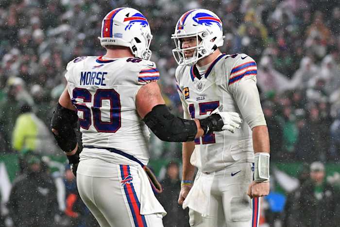 Buffalo Bills center Mitch Morse (60) and quarterback Josh Allen (17) celebrate a touchdown against the Philadelphia Eagles at Lincoln Financial Field
