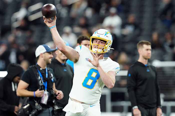 Dec 14, 2023; Paradise, Nevada, USA; Los Angeles Chargers quarterback Max Duggan (8) warms up before the game against the Las Vegas Raiders at Allegiant Stadium. Mandatory Credit: Stephen R. Sylvanie-USA TODAY Sports