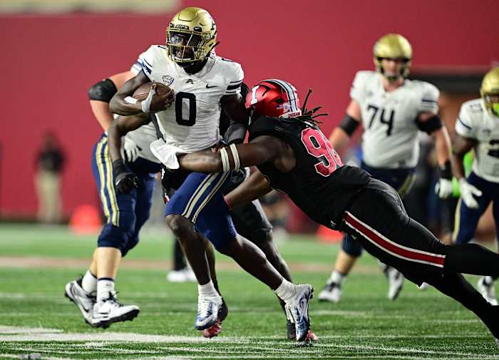 Akron Zips quarterback DJ Irons (0) is tackled by Indiana Hoosiers defensive lineman Philip Blidi (96) during the second half at Memorial Stadium.