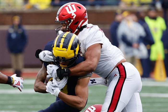 Michigan Wolverines wide receiver Tyler Morris (8) is tackled by Indiana Hoosiers linebacker Jacob Mangum-Farrar (7) in the first half at Michigan Stadium.