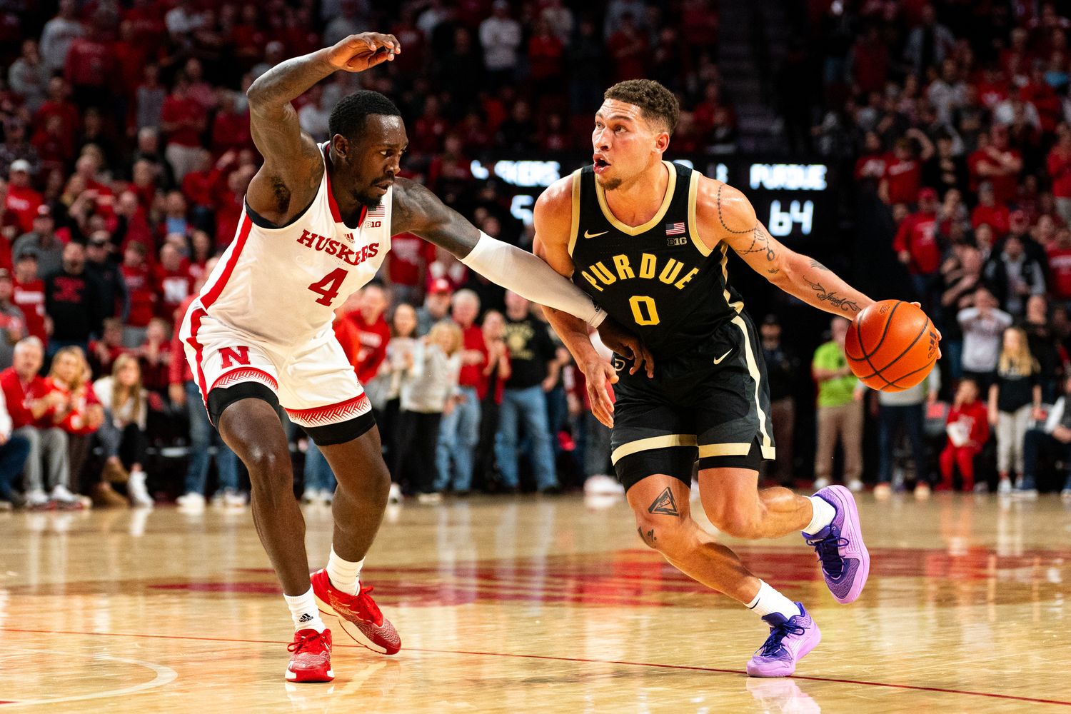 Purdue forward Mason Gillis drives against Nebraska forward Juwan Gary during the second half at Pinnacle Bank Arena in Lincoln. (Jan 9, 2024)