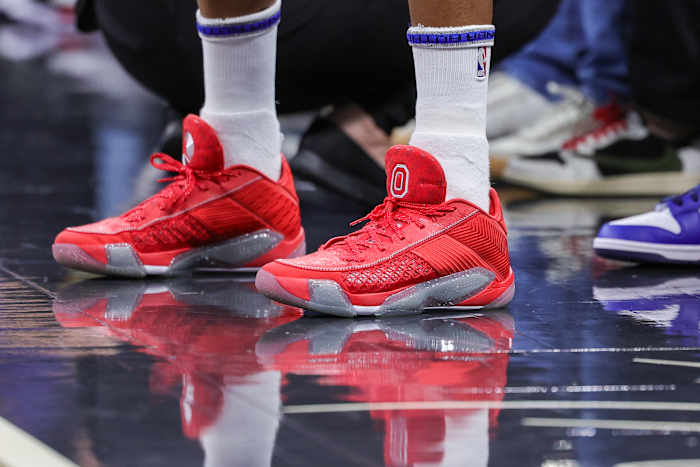 Minnesota Timberwolves guard Mike Conley's scarlet and grey Air Jordan sneakers.