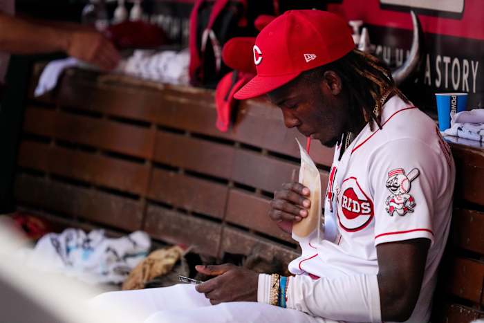 Elly De La Cruz (44) sips a smoothie on the bench in the eighth inning of the MLB Interleague game between the Cincinnati Reds and the Minnesota Twins at Great American Ball Park in downtown Cincinnati on Wednesday, Sept. 20, 2023.