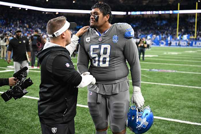 Oct 30, 2023; Detroit, Michigan, USA; Las Vegas Raiders head coach Josh McDaniels congratulates Detroit Lions offensive tackle Penei Sewell (58) after the Lions beat the Raiders in Monday Night Football at Ford Field.