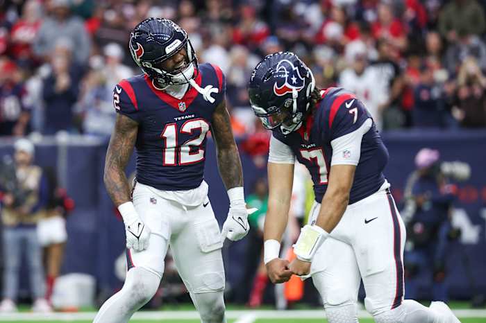 Nico Collins and C.J. Stroud dance together in celebration