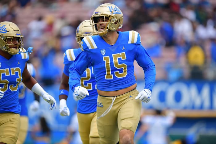Laiatu Latu (15) celebrates after intercepting a pass against the North Carolina Central Eagles