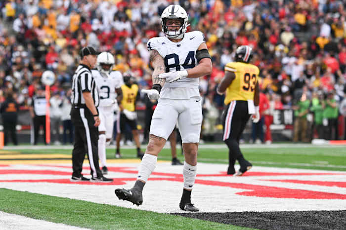 Theo Johnson (84) reacts after catching a shovel pass for a touchdown during the first half against the Maryland Terrapins