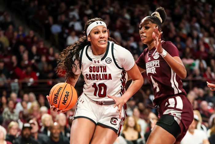 Kamilla Cardoso drives around Mississippi State Bulldogs