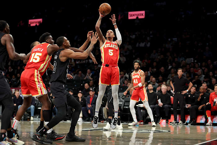 Atlanta Hawks guard Dejounte Murray (5) shoots against Brooklyn Nets center Nic Claxton (33)