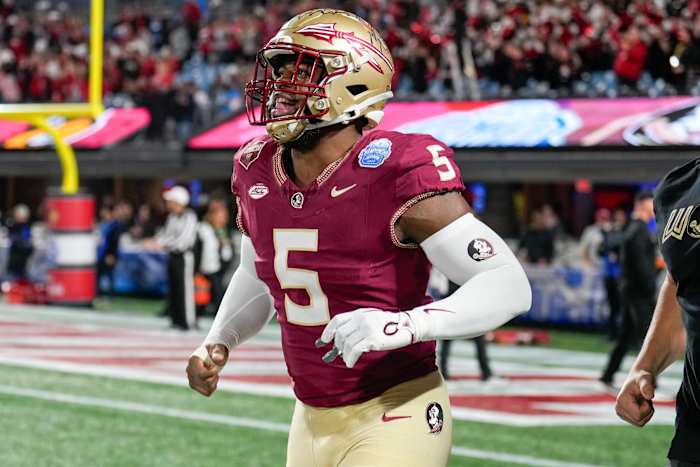Florida State Seminoles defensive lineman Jared Verse (5) during warm ups against the Louisville Cardinals at Bank of America Stadium.