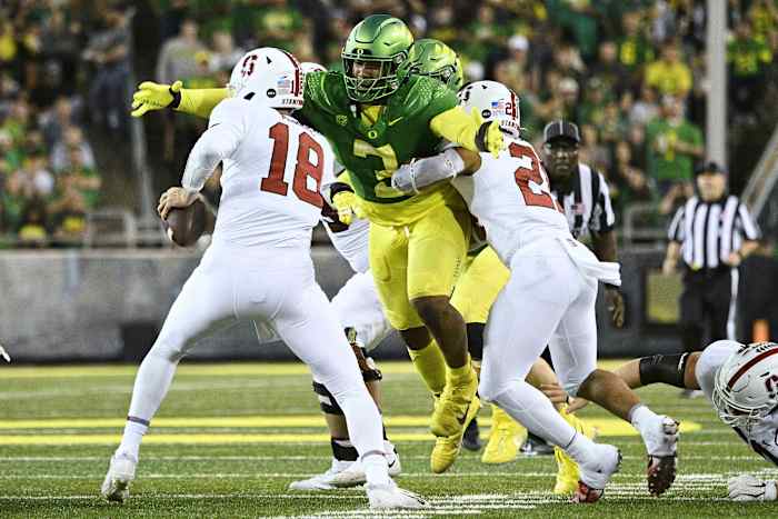 Oct 1, 2022; Eugene, Oregon, USA; Oregon Ducks defensive end Brandon Dorlus (3) sacks Stanford Cardinal quarterback Tanner McKee (18) during the second half at Autzen Stadium. The Ducks won the game 45-27. Mandatory Credit: Troy Wayrynen-USA TODAY Sports