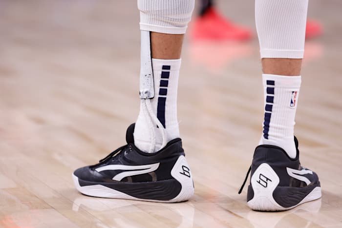 Denver Nuggets forward Michael Porter Jr.'s black and white PUMA sneakers.