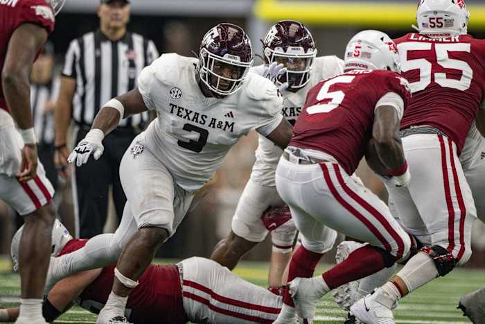 Sep 30, 2023; Arlington, Texas, USA; Texas A&M Aggies defensive lineman McKinnley Jackson (3) and Arkansas Razorbacks running back Raheim Sanders (5) in action during the game between the Texas A&M Aggies and the Arkansas Razorbacks at AT&T Stadium. Mandatory Credit: Jerome Miron-USA TODAY Sports  