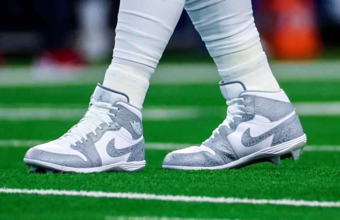 Dallas Cowboys quarterback Dak Prescott's white and grey Air Jordan cleats.