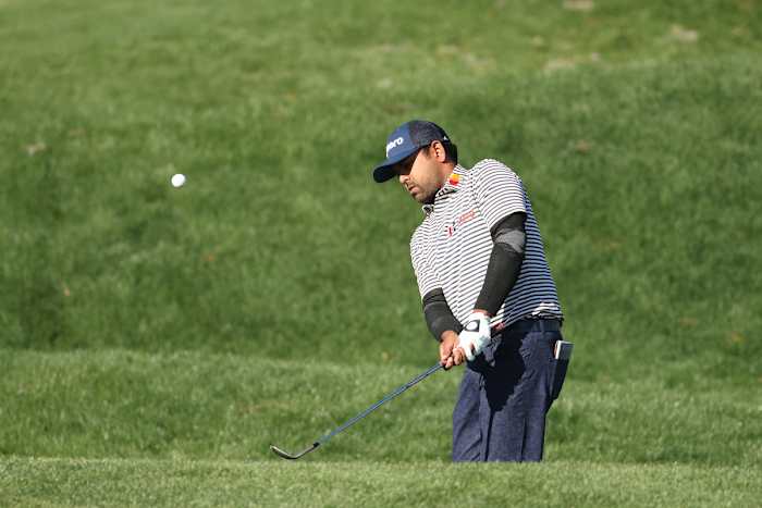 Anirban Lahiri chips during the 2022 Players Championship.
