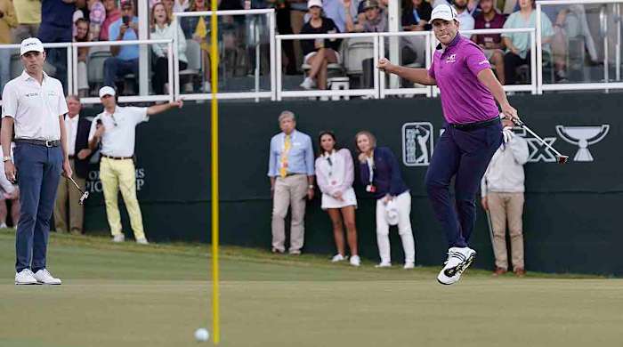 Luke List, right, leaps as he sinks a 43-foot putt for birdie on No. 18 for the win at the Sanderson Farms Championship golf tournament Sunday, Oct. 8, 2023, in Jackson, Miss.