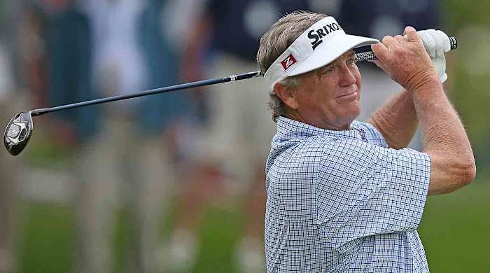 Peter Jacobsen watches his tee shot on the 14th hole during the first round of the 2023 KitchenAid Senior PGA Championship at Oak Hill Country Club.