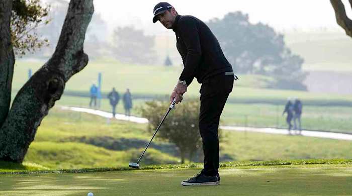 Aaron Rodgers watches a putt in the third round of the 2023 AT&T Pebble Beach Pro-Am.