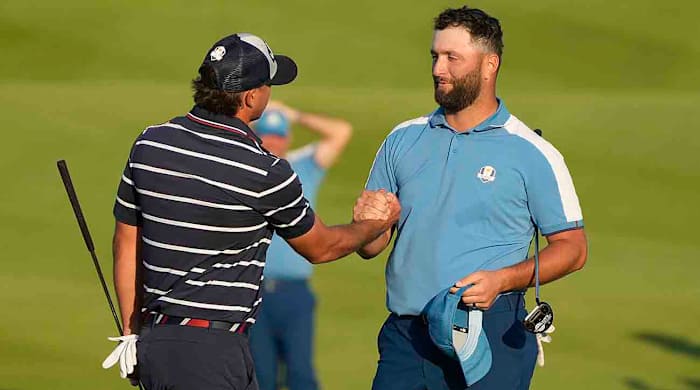 Europe's Jon Rahm shakes hands with United States' Brooks Koepka after the match was tied in their afternoon fourballs match at the 2023 Ryder Cup golf tournament at the Marco Simone Golf Club in Italy.