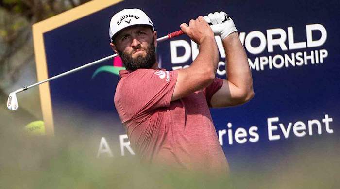 Jon Rahm of Spain tees off at the 11th hole during the 2023 DP World Tour Championship in Dubai, United Arab Emirates.