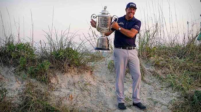 Phil Mickelson poses with the trophy after winning the 2021 PGA Championship at Kiawah Island, S.C.