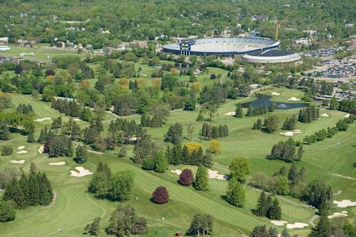 The University of Michigan Golf Course, designed by Alister MacKenzie in the late 1920s, sits directly across the street from Michigan Stadium and Crisler Center.