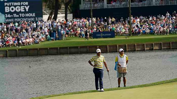 Hideki Matsuyama is pictured at the 17th green during the 2023 Players Championship.