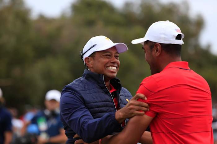 Tiger Woods, who went 3-0 as a player, also emerged unbeaten as a captain as he and Tony Finau celebrate the Americans’ Presidents Cup triumph at Royal Melbourne.