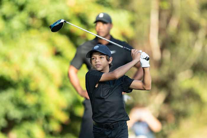 Charlie Woods hits a shot at the 2021 PNC Championship.