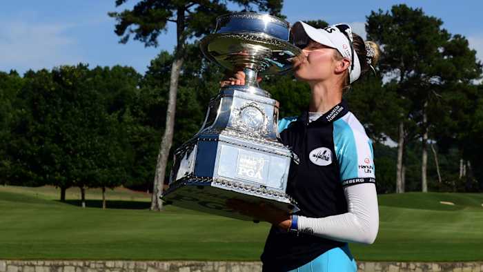 Nelly Korda poses with the championship trophy as she celebrates winning the KPMG Women's PGA Championship golf tournament at the Atlanta Athletic Club.