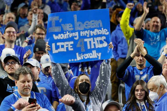 Detroit Lions fans celebrate after the Lions beat the L.A. Rams, 24-23, in the wild-card round of the NFL playoffs at Ford Field in Detroit on Sunday, Jan. 14, 2024.