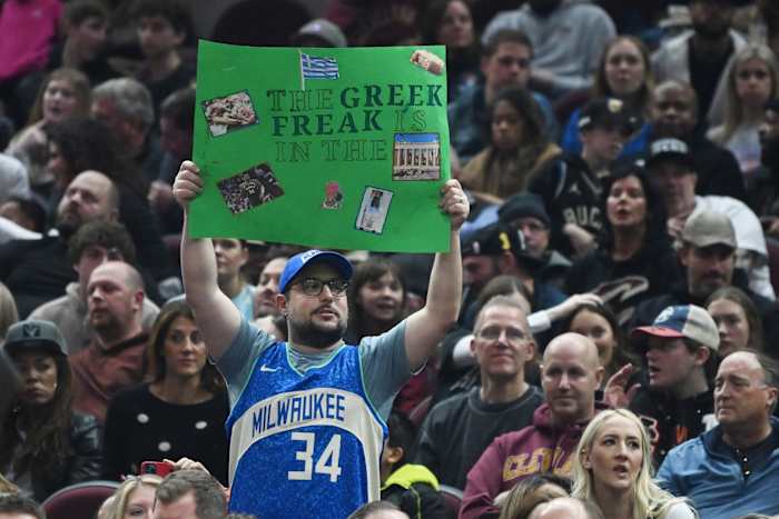 A fan holds a sign in support of Milwaukee Bucks forward Giannis Antetokounmpo (34)