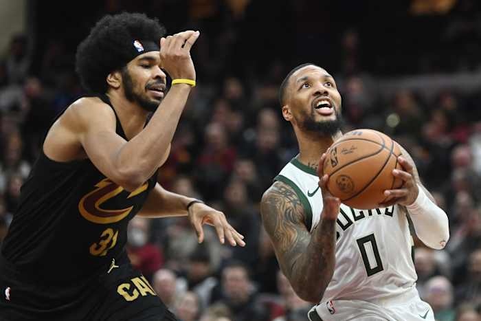 Milwaukee Bucks guard Damian Lillard (0) drives to the basket against Cleveland Cavaliers center Jarrett Allen (31) 