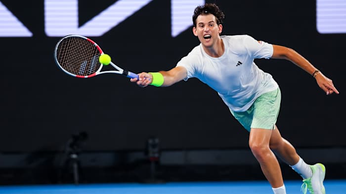 Dominic Thiem of Austria plays a shot against Felix Auger Aliassime.