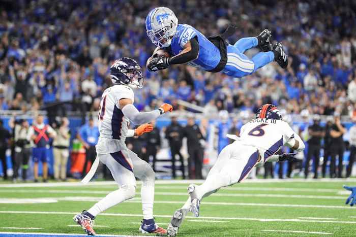 Detroit Lions wide receiver Amon-Ra St. Brown dives for a touchdown.