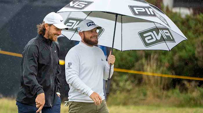 Tommy Fleetwood (left) and Tyrrell Hatton talk on the fourth hole during a practice round at the 2023 British Open.