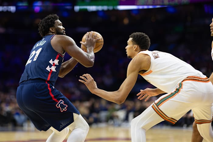 Jan 22, 2024; Philadelphia, Pennsylvania, USA; Philadelphia 76ers center Joel Embiid (21) shoots against San Antonio Spurs center Victor Wembanyama (1) during the second quarter at Wells Fargo Center.