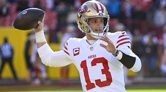 49ers quarterback Brock Purdy throws a pass in warmups before a game.