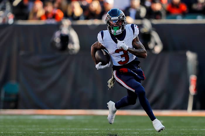 Texans wide receiver Tank Dell (3) runs with the ball against the Cincinnati Bengals in the first half at Paycor Stadium.