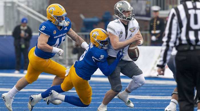 Bryun Parham strips the ball out of an Eastern Michigan quarterback's hands in the 2022 Idaho Potato Bowl.