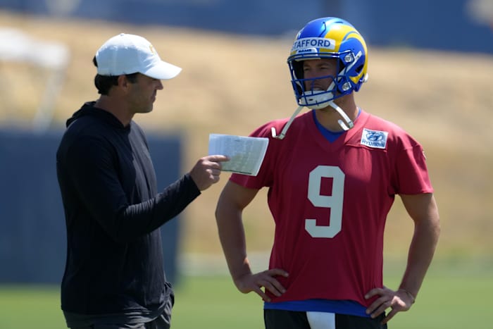 Jun 3, 2022; Thousand Oaks, CA, USA; Los Angeles Rams quarterback Matthew Stafford (9) and quarterbacks coach Zac Robinson during organized team activities at California Lutheran University.
