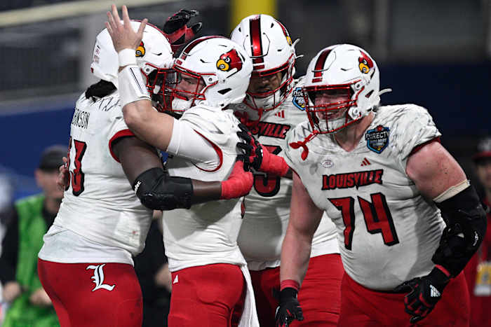 Dec 27, 2023; San Diego, CA, USA; Louisville Cardinals quarterback Evan Conley (6) celebrates with teammates after scoring a touchdown against the USC Trojans during the first half at Petco Park. Mandatory Credit: Orlando Ramirez-USA TODAY Sports