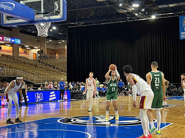 Orlando Magic rookie Jett Howard (13) takes a free throw while two-way NBA veteran Trevelin Queen (13) looks on.