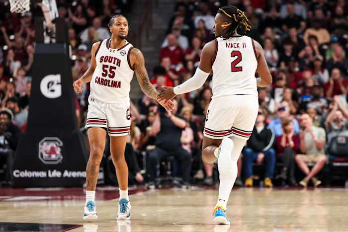 Ta'Lon Cooper and forward B.J. Mack celebrate a basket against the Missouri Tigers