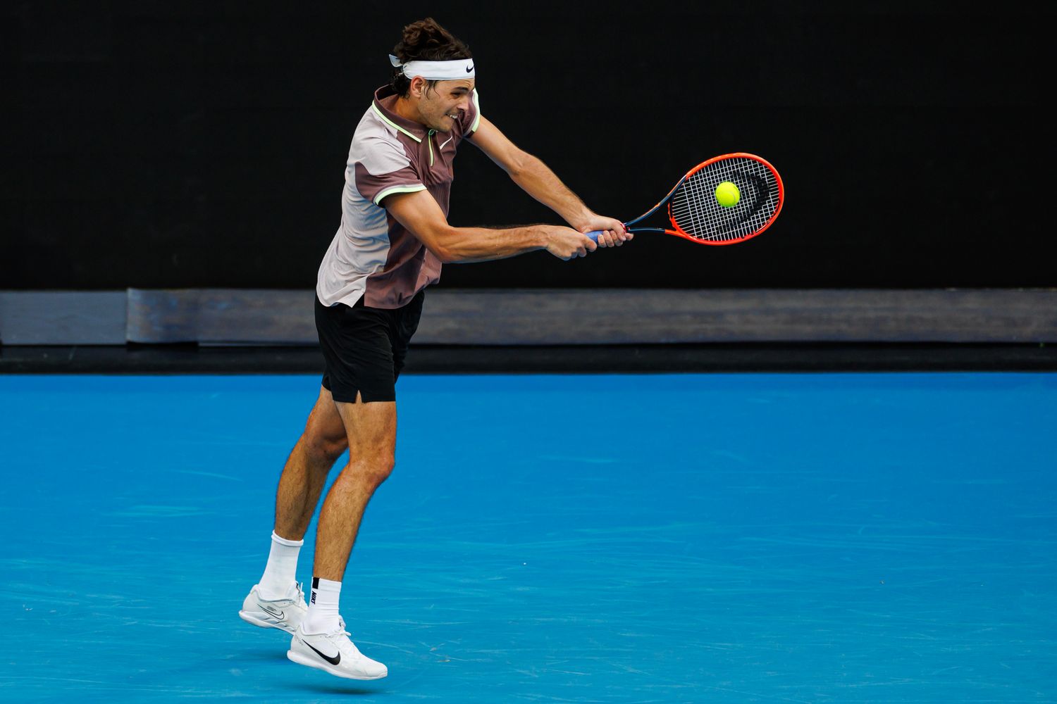 Taylor Fritz hits a shot at the 2024 Australian Open.