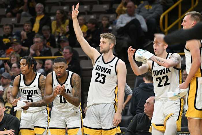 Iowa Hawkeyes guard Dasonte Bowen (5) and guard Tony Perkins (11) and forward Ben Krikke (23) and forward Patrick McCaffery (22) react during the second half against Alabama State Hornets at Carver-Hawkeye Arena.