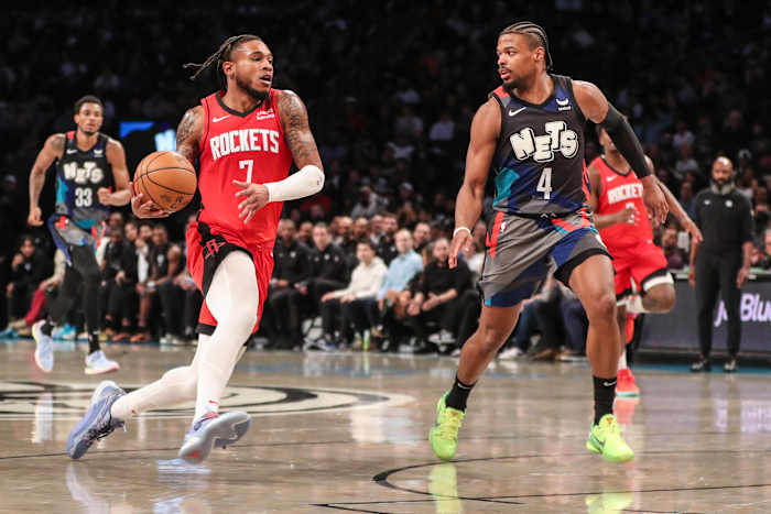 Rockets forward Cam Whitmore (7) looks to drive past Brooklyn Nets guard Dennis Smith Jr. (4) in the fourth quarter at Barclays Center.