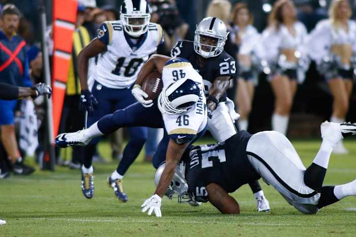 Aug 19, 2017; Oakland, CA, USA; Oakland Raiders defensive tackle Darius Latham (75) tackles Los Angeles Rams tight end Cory Harkey (46) during the third quarter at Oakland Coliseum.