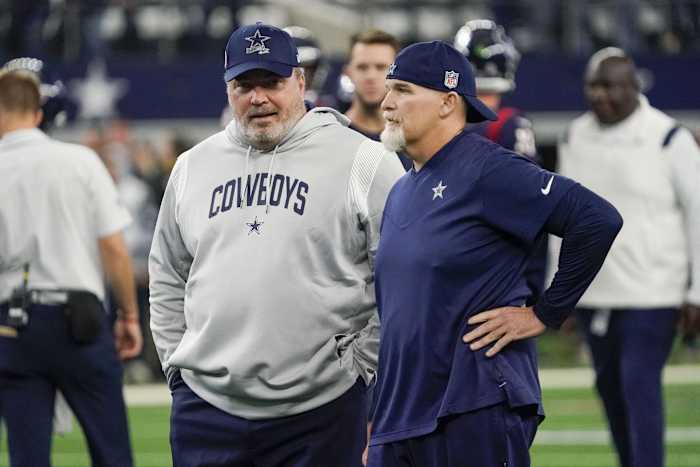 Dec 11, 2022; Arlington, Texas, USA; Dallas Cowboys head coach Mike McCarthy and defensive coordinator Dan Quinn talk at midfield prior to a game against the Houston Texans at AT&T Stadium.